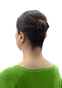 woman with hair tied back